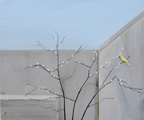 Almond tree in the backyard with a goldfinch
